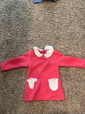 Richie House pink chain stitch dress with white lace pockets.